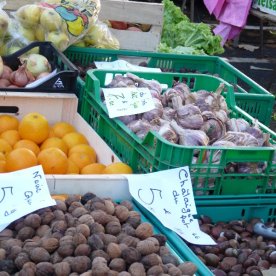 Seasonal walnuts and chestnuts on a greengrocery stall
