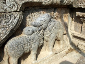 Trompe l'oeuil: Is the cow's head resting on the elephant, or is it the other way about?