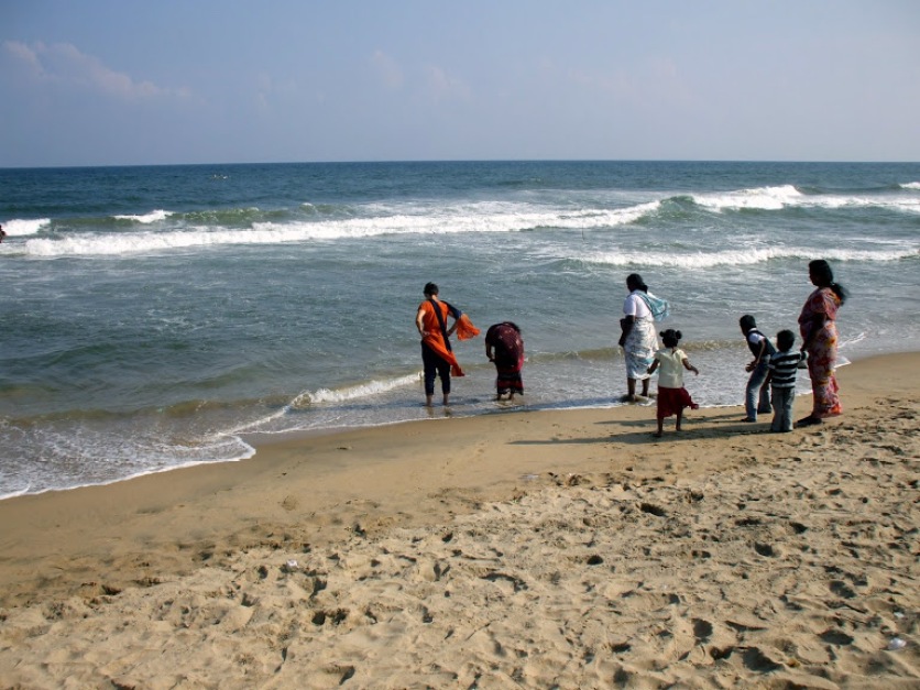 A family relaxing on the beach in Chennai