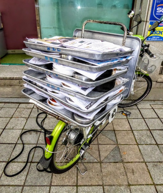 I chose this bicycle from Seoul, South Korea, loaded up with lunch time meals, cooked in tiny kitchens, and delivered to workers on site.